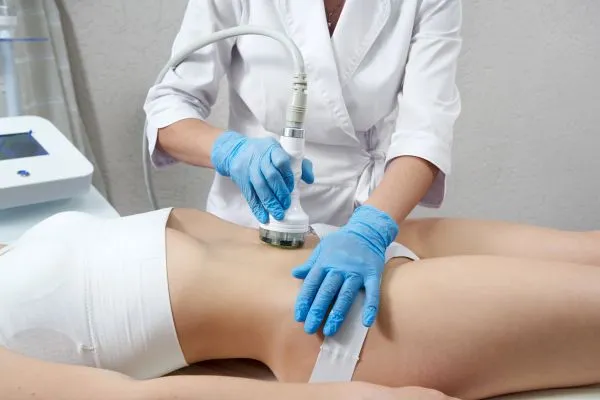 Lost the Weight but Not the Loose Skin? 2 woman having HIFU treatment on her stomach to combat loose skin London following weight loss